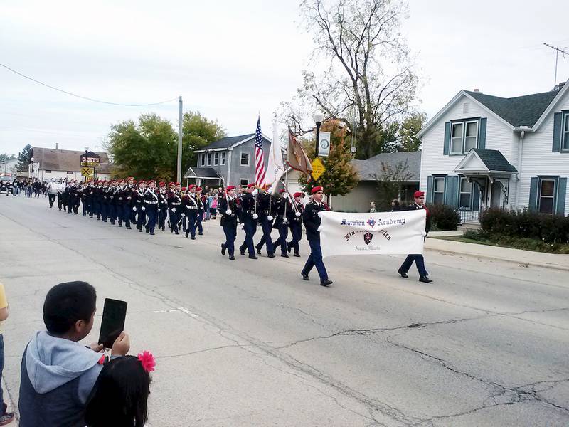 Marmion Academy impressed watchers of the Cortland Fall Festival Parade on Oct. 12 with its rifle squad maneuvers.