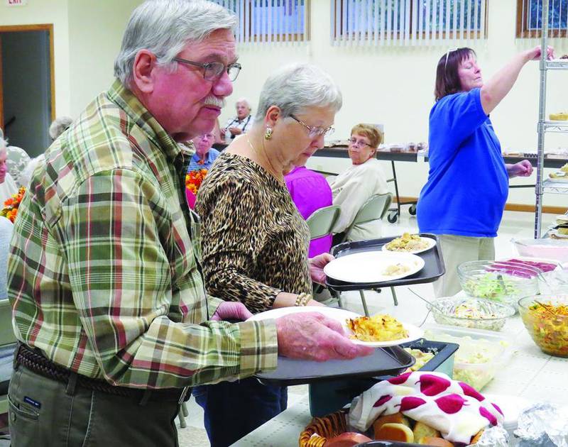 Jim and Barb Sissel of Princeton grab a bite to eat at the annual Fall Festival Bazaar and Supper hosted by First Congregational Church of Bureau on Oct. 20. The event drew residents from all over Bureau and Putnam counties. Attendees ate dinner, shopped through bazaar items and enjoyed the camaraderie.