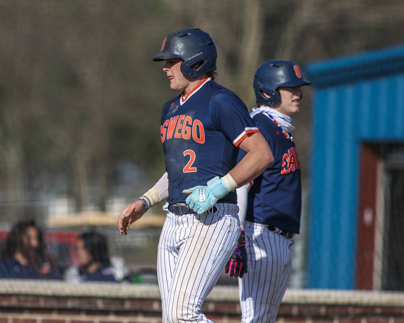 Oswego's Easton Ruby (2) crosses the plate during baseball game between Plainfield South at Oswego on Monday, April 14, 2025 in Oswego.