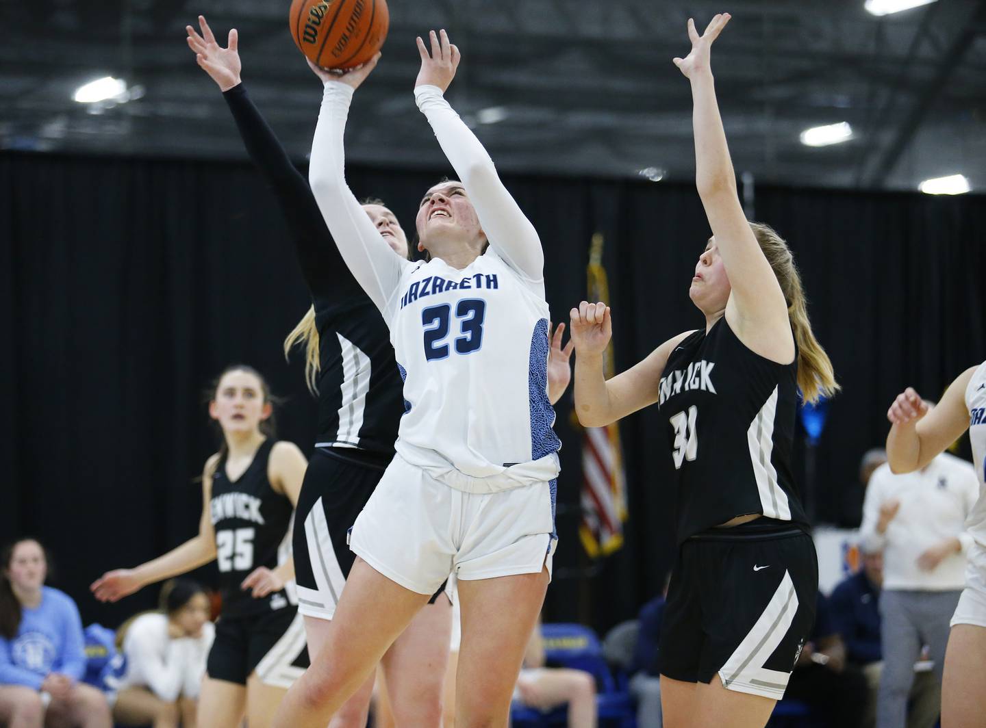 Nazareth's Danni Scully takes a shot during the girls IHSA 3A Supersectional basketball game between Nazareth Academy and Fenwick High School on Monday, February 28, 2022 at De La Salle High School in Chicago.