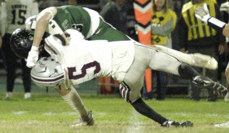 Phillip Griffith Jr. is taken down by IVC defender Colin Toliver.  The Grey Ghosts of Illinois Valley Central traveled to Hinders Field in Rock Falls on Friday, October 10, 2025 to take on the Rockets.