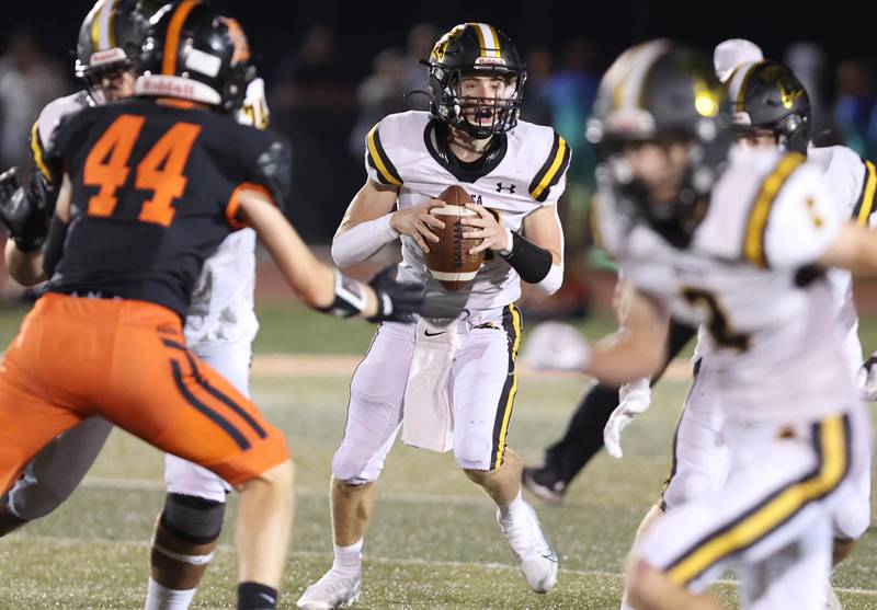 Metea Valley quarterback Lucas Van Vlerah looks for a receiver during their game Friday, Sept. 16, 2022, at DeKalb High School.