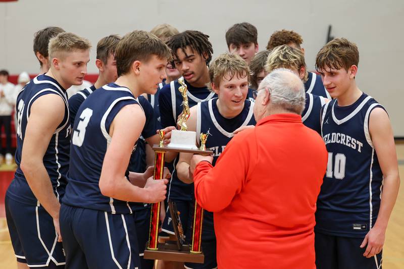 2024 Colmone Classic Champions-Fieldcrest receive trophy from Frank Colmone on Saturday, December 14, 2024 at Hall High School in Spring Valley.