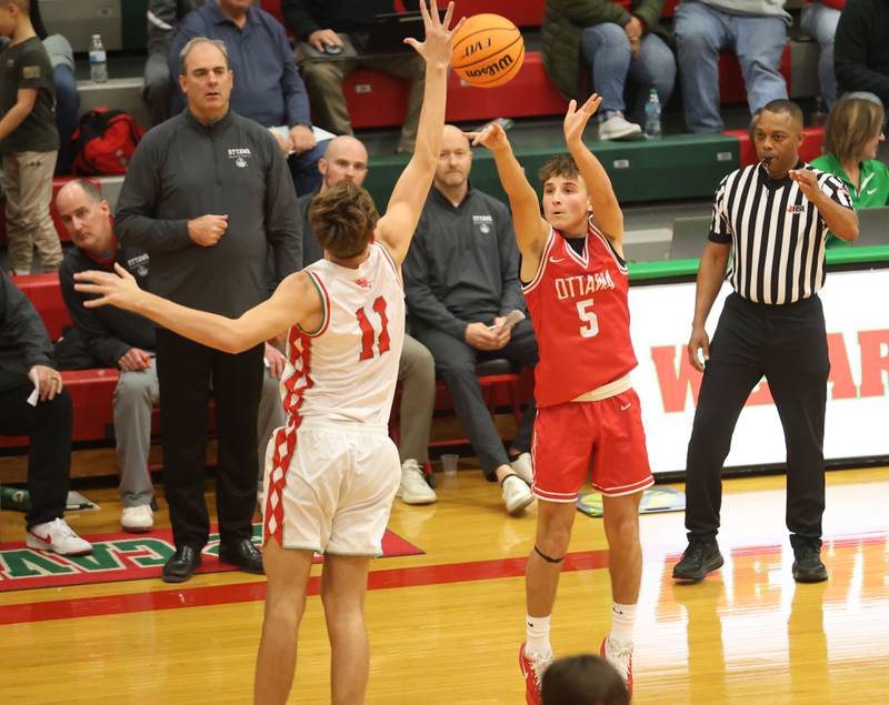 Ottawa's Rory Moore lets go of a jump shot over L-P's Jameson Hill on Friday, Jan. 9, 2026 in Sellett Gymnasium at L-P High School.