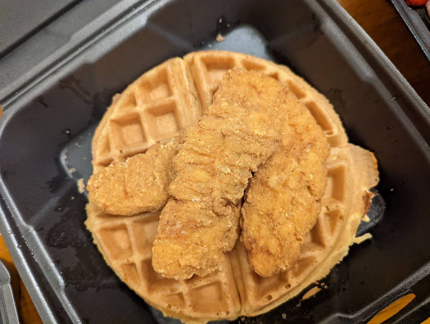 We only saw this chicken waffle from Happy Place Cafe in Shorewood available on its online menu. But I'm happy we found it. The photo looks plain, but the flavors of both the waffle and chicken were outstanding made a heavenly combination.