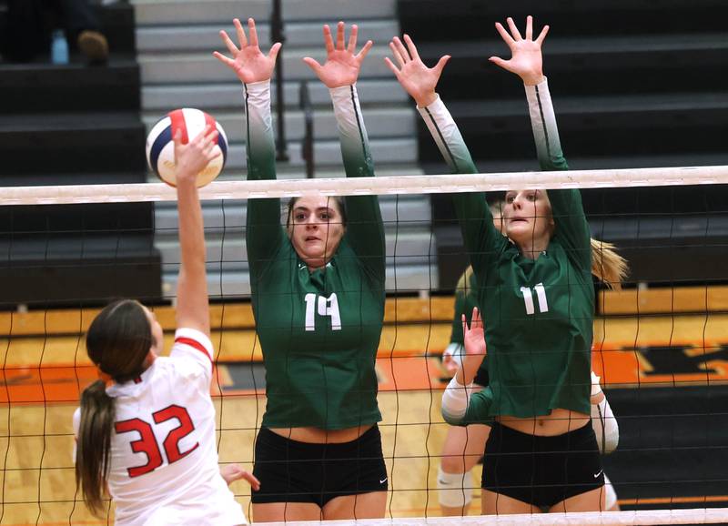 Fremd’s Victoria Belmonte (left) and Natasa Radisic try to block Huntley's Izzy Whitehouse Monday, Nov. 11, 2024, during their Class 4A supersectional match against Fremd at DeKalb High School.