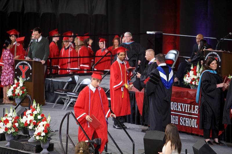 Yorkville High School Graduates receive their diploma at the Commencement Ceremony at NIU Convocation Center on Friday, May 16, 2025 in DeKalb.