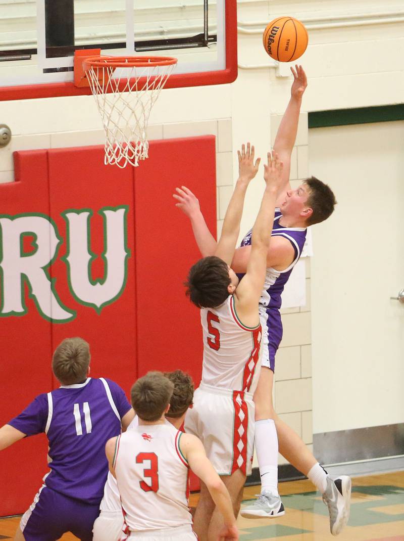 Rochelle's Eli Schweitzer lets go of a shot over L-P's Erick Sotelo on Friday, Feb. 13, 2026 in Sellett Gymnasium at L-P High School.