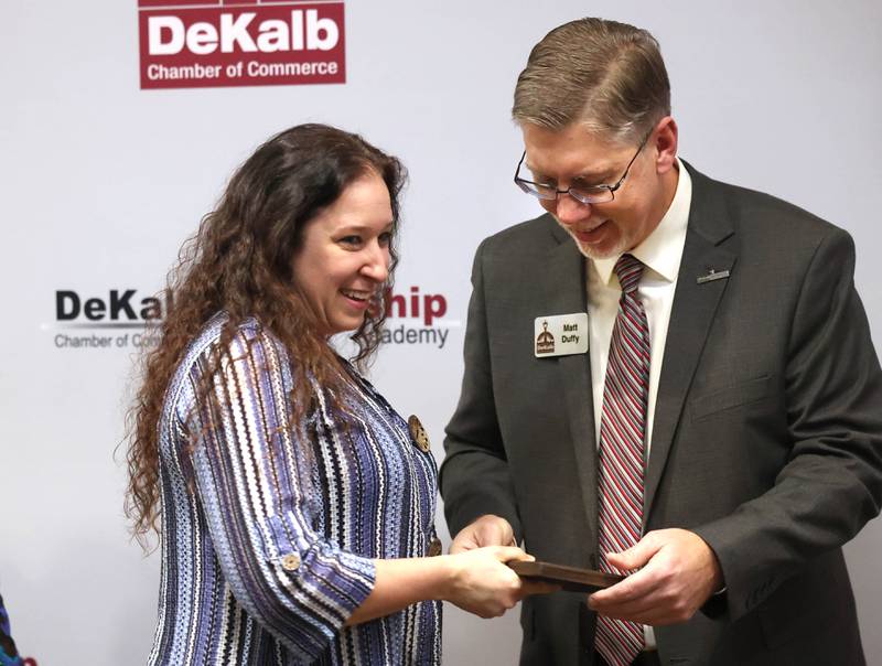 Michelle Groeper from Tails Humane Society accepts the Nonprofit Organization Award on behalf of Tails from Matt Duffy, executive director of the DeKalb Chamber of Commerce Thursday, Feb. 5, 2026, during the DeKalb Chamber of Commerce Annual Celebration Dinner at Faranda's Banquet & Conference Center.