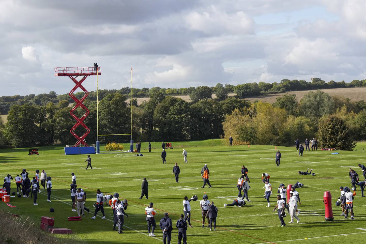 Chicago Bears stretch during a training session in Ware, England, Thursday, Oct. 10, 2024, ahead of the game between the Chicago Bears and the Jacksonville Jaguars at Tottenham Hotspur Stadium on Sunday. (AP Photo/Sean Ryan)