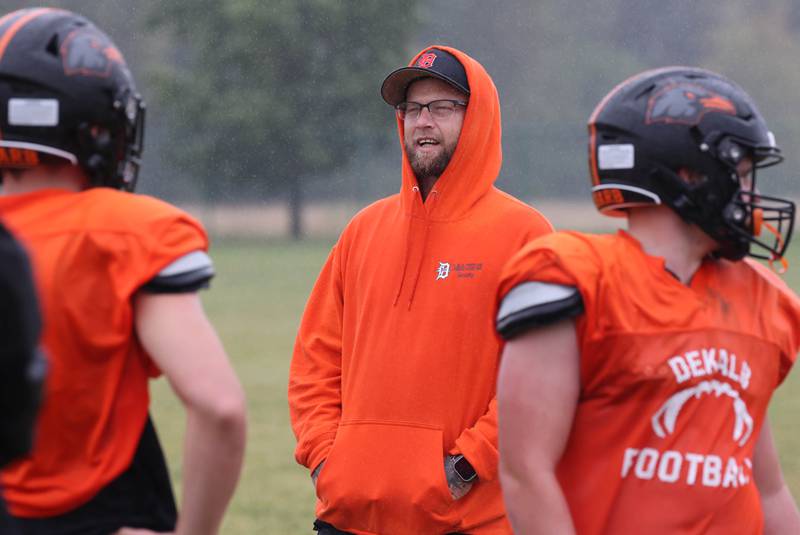 Matt Quinto, U.S. Navy veteran and DeKalb High School football coach, talks to players during practice Tuesday, Sept. 24, 2024, at DeKalb High School.