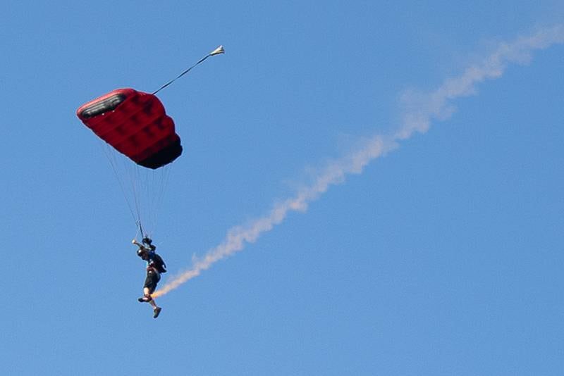 Skydivers from Skydive Chicago soar overhead opening day of youth soccer on Saturday, Aug 16, 2025, at Peck Park in Ottawa.
