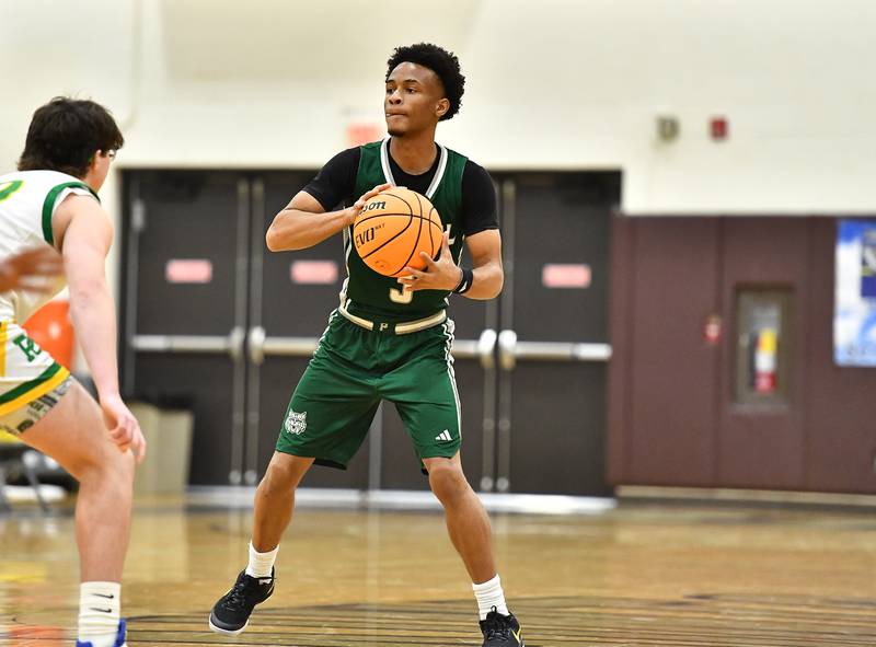 Plainfield Central's Zion Finch (3) looks to pass the ball during the WJOL tournament game against Providence Catholic on Friday, NOV. 28, 2025, at Joliet.