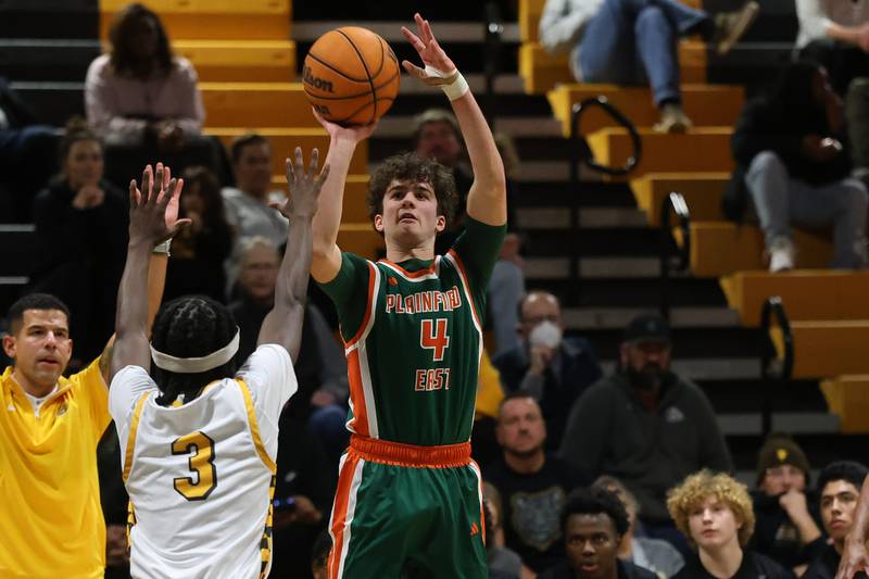 Plainfield East’s Justin Paszkowski takes the outside shot against Joliet West on Friday, Dec. 19, 2025 in Joliet.