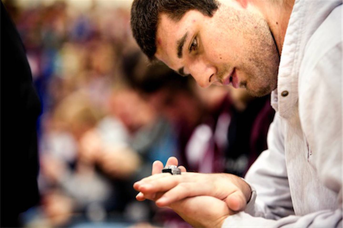 Prairie Ridge senior tight end and punter Nick Margiotta looks at his IHSA Class 6A football state title ring after receiving it Wednesday during an assembly at the high school in Crystal Lake. The school also honored athletes from other sports and students selected to the All-State choir.