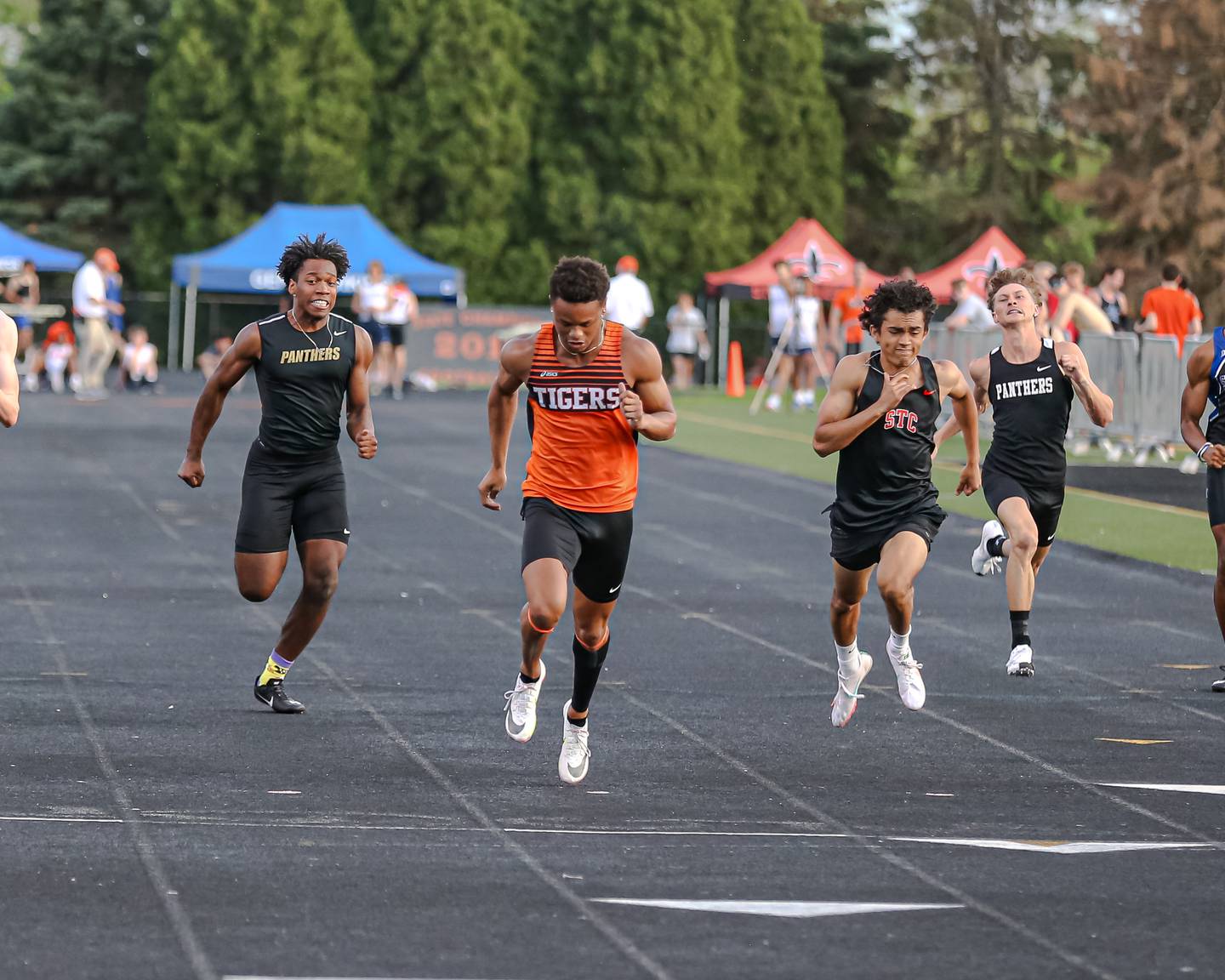 Wheaton Warrenvile South's Reece Young wins the 100m during the DuKane Conference Track and Field meet at Wheaton Warrenville South.  May 13.2022.