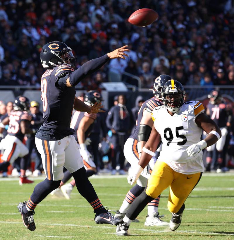 Chicago Bears quarterback Caleb Williams gets off a pass ahead of the pressure of Pittsburgh Steelers defensive tackle Keeanu Benton Sunday, Nov. 23, 2025, during their game at Soldier Field in Chicago.