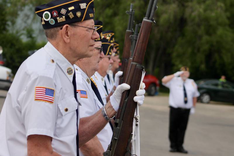 An honor guard completes its rifle salute on Monday, May 29, 2023, during a Memorial Day observance along the Rock River in Rock Falls.