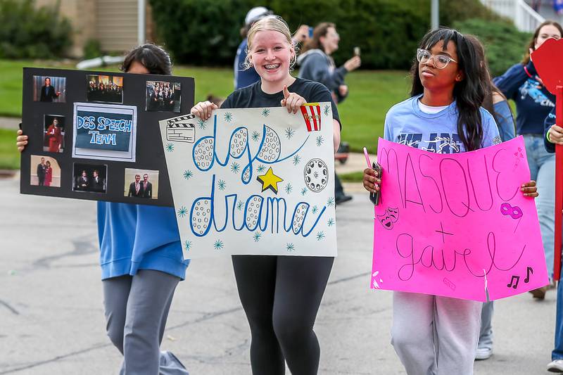 Speech and Dram club students march in the Downers Grove South Homecoming Parade. Sept 28, 2024 in Downers Grove.