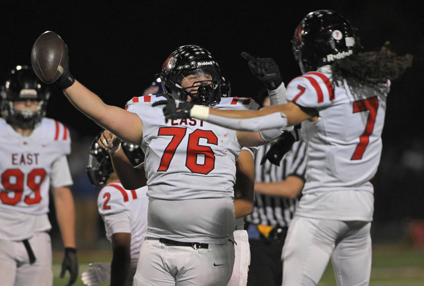 Glenbard South’s Glenbard East’s Cooper Conliss celebrates his fumble recovery with teammate Stevyn Fox in a football game at South High School in Glen Ellyn on Friday, Oct. 18, 2024.