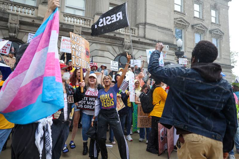 Protestors continue chants through the rain at the Kankakee County Courthouse during the No Kings Rally on Saturday, Oct. 18, 2025.