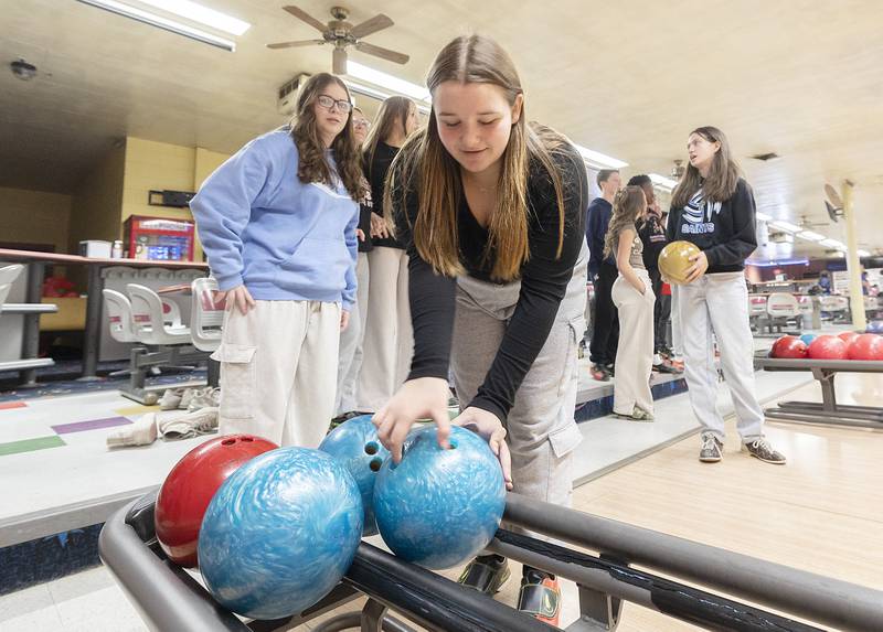 St. Mary’s eighth grader Irelynne Wren grabs a ball Tuesday, Jan. 28, 2025, for her frame at Blackhawk Lanes.