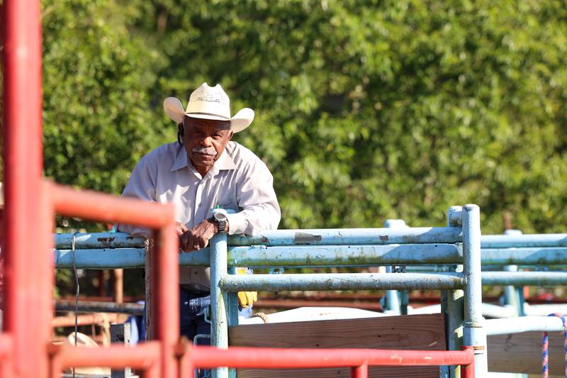 Mike Latting, owner of Latting Rodeo Productions, sits atop the bullpen during the 50th Pembroke Rodeo on Sunday, May 24, 2026.