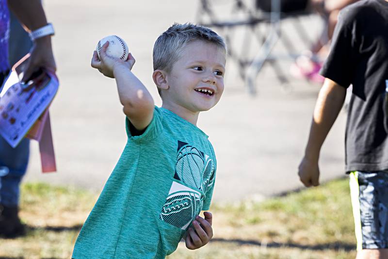 Kayson Janssen, 4, fires a ball at the dunk tank Thursday, August 31, 2023 during the Dixon PTO fun day.