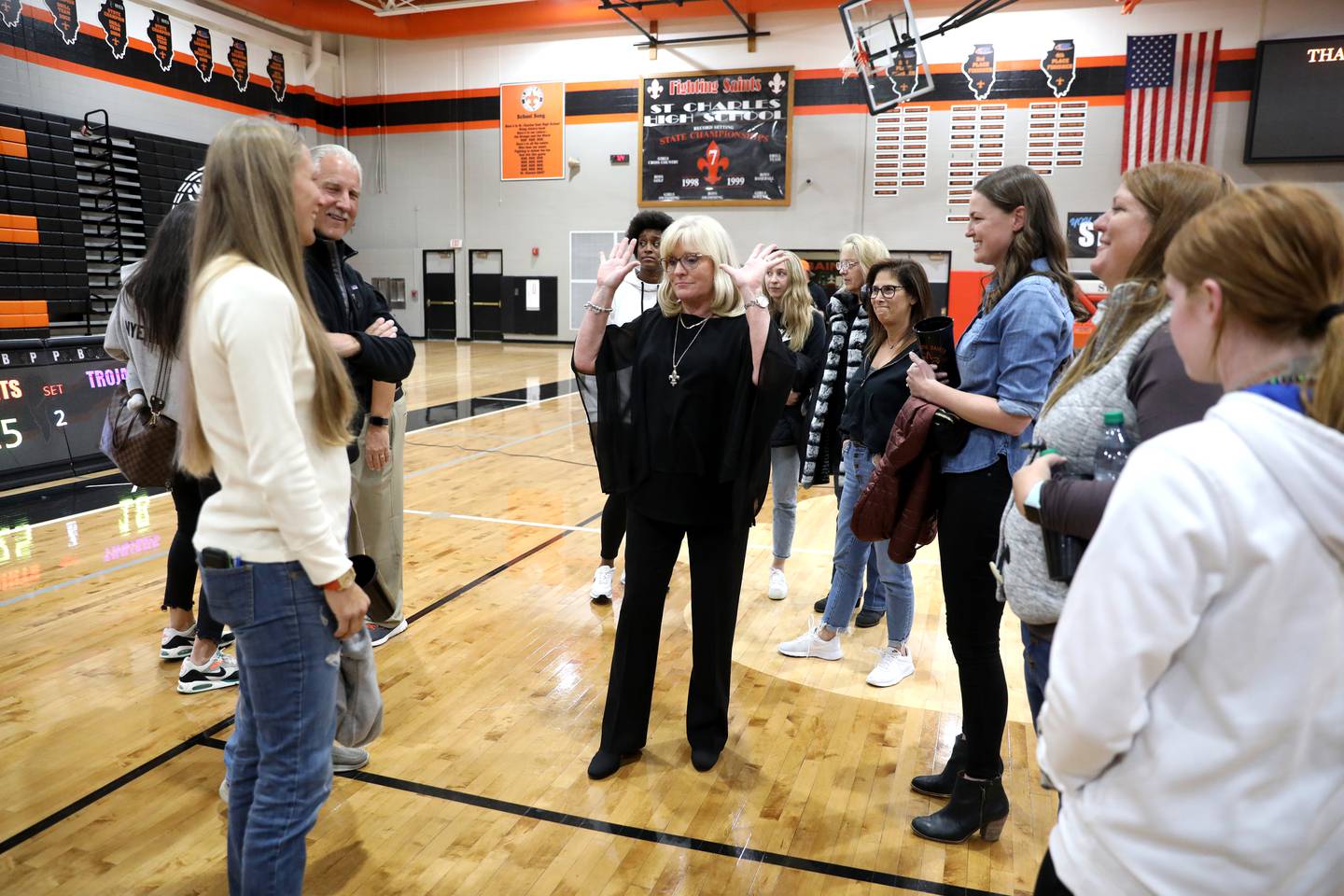 St. Charles East head girls volleyball coach Jennie Kull (center) was honored following her final regular season home game on Wednesday, Oct. 19, 2022. This is Kull’s final season at East after more than 25 years.