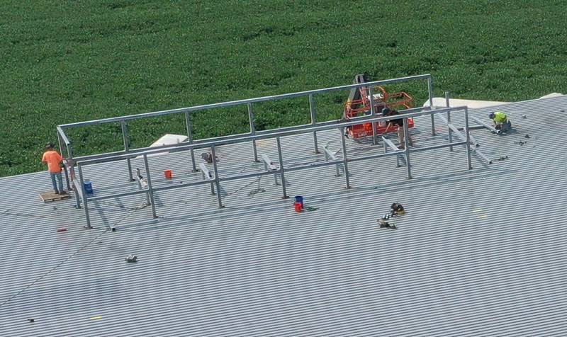 Crews work on the rooftop at the future Aldi grocery store on Tuesday, Aug. 13, 2025 at the intersection of Backbone Road and North Main Street in Princeton. Workers are beginning to build the exterior walls this week. The 20,000 square-foot store could be open by Thanksgiving.