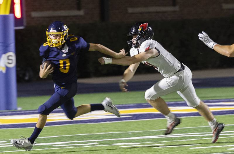 Sterling’s Wyatt Cassens runs for yards against Metamora Friday, Aug. 30, 2024 at Sterling High School.