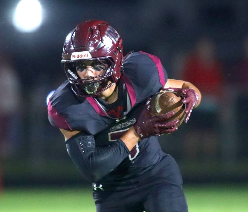 Marengo’s Gavin Baros runs the ball against Johnsburg in varsity football at Rod Poppe Field on the campus of Marengo High School in Marengo on Friday, Oct. 3, 2025.