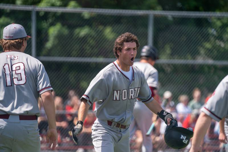 Plainfield North's Brandon Bak (20) reacts after scoring against Yorkville during the Class 4A Yorkville Regional baseball final at Yorkville High School on Saturday, May 28, 2022.