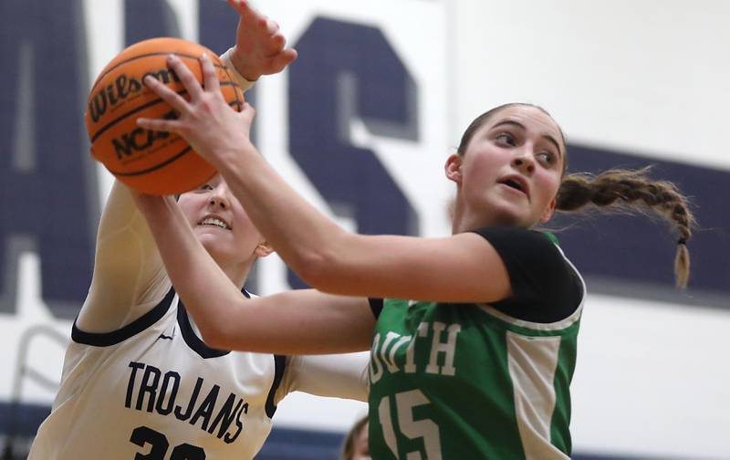 Cary-Grove's Olivia Leuze tries to knock a rebound away from Crystal Lake South's Tessa Melhuish during a Fox Valley Conference girls basketball game on Tuesday, Dec. 2, 2025, at Cary-Grove High School in Cary.