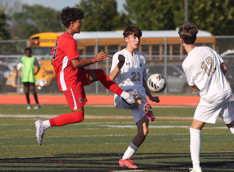 Yorkville's Izai Terrazas (left) and Sycamore's Leo Padilla try to win possession Thursday, Aug. 28, 2025, during their game in the Barb Cup tournament at DeKalb High School.