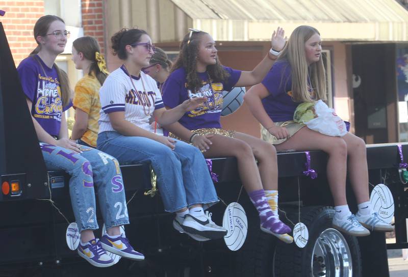 Members of the Mendota High School volleyball team ride down Indiana Avenue during the homecoming parade on Friday, Oct. 3, 2025