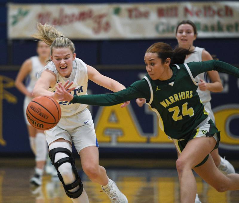 John Starks/jstarks@dailyherald.com
Waubonsie Valley;s Khaliah Reid recovers a loose ball in from of Wheaton North's Eden Pearson at the Wheaton North girls basketball tournament on Tuesday, December 27, 2022.