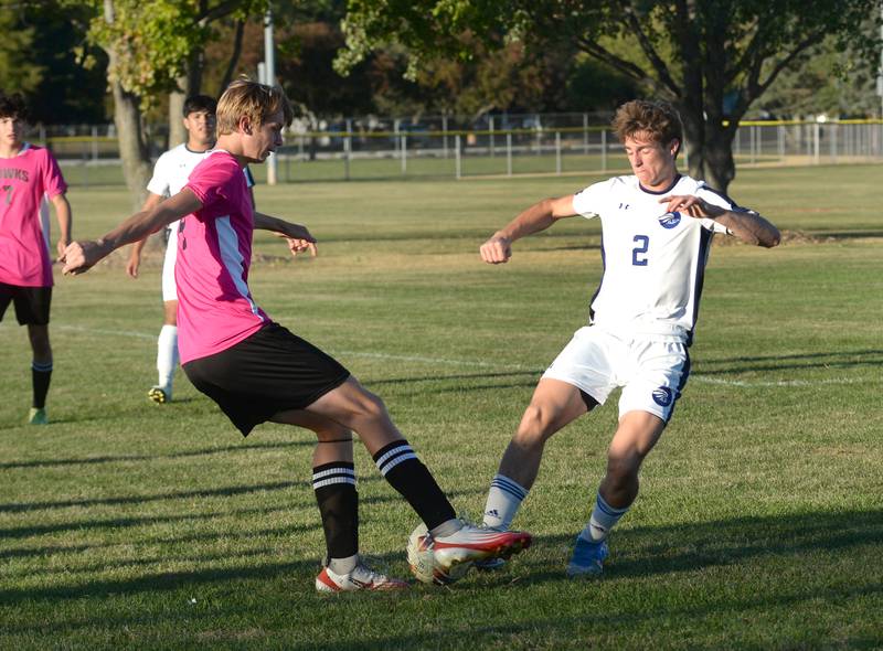 Oregon's Owen Wynn and Faith Christian's Brady Bivins reach for the ball during a Thursday, Oct. 9, 2025 game at Oregon Park West.
