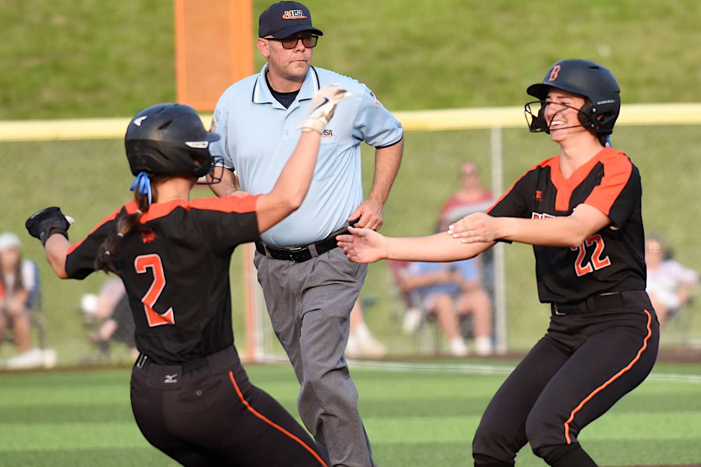 Beecher's Taylor Norkus, right, is greeted by teammate Makenie Johnson after Norkus' 10th-inning walk-off single to give the Bobcats a 4-3 win over Brimfield in the Class 2A East Peoria Super-Sectional Monday, June 2, 2025.