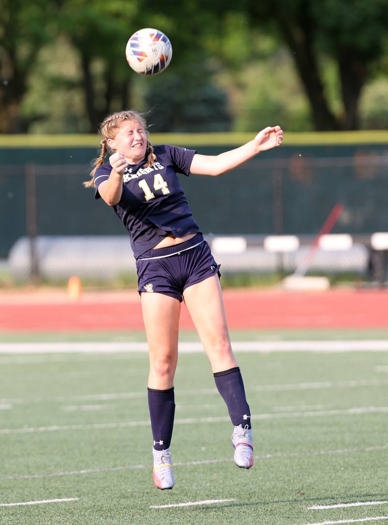 IC Catholic's Lucy Ross (14) heads the ball during the IHSA Class 1A girls soccer super-sectional match between Richmond-Burton and IC Catholic at Concordia University in River Forest on Tuesday, May 23, 2023.