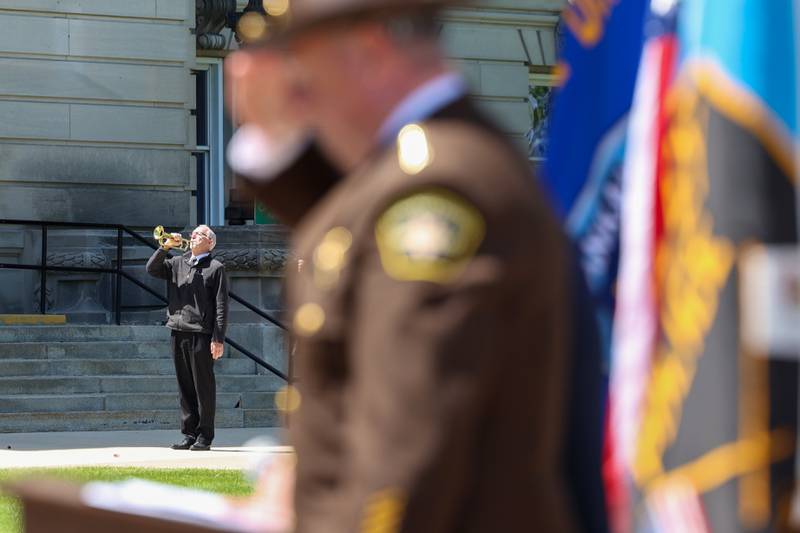 Eric Penrod performs 'Taps' following the roll call of fallen officers during the Kankakee County Law Enforcement Memorial on Thursday, May 14, 2026, at the Kankakee County Courthouse.