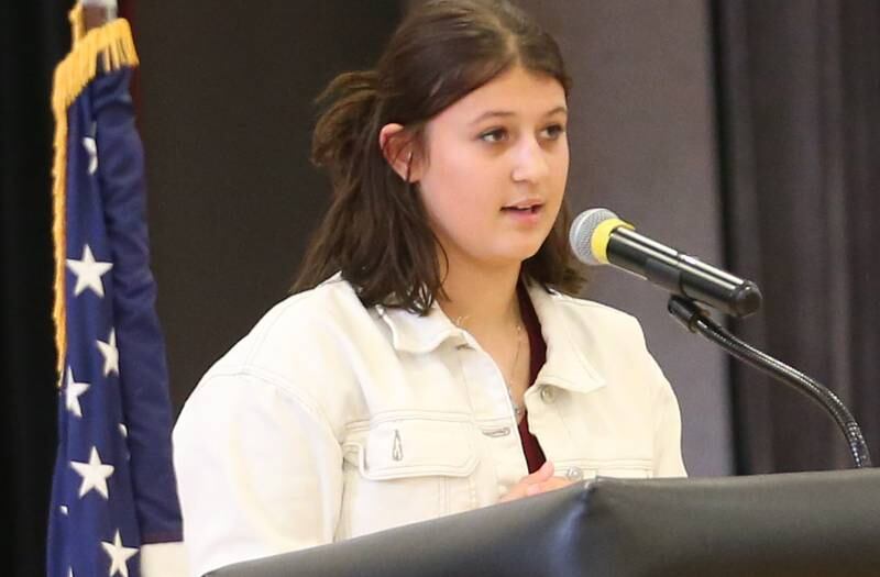 Parkside student Grace Pack reads her poems "Thank You Veterans and You're my Hero" during the annual Veterans Day Program on Monday, Nov. 11, 2024 at Parkside Middle School in Peru.