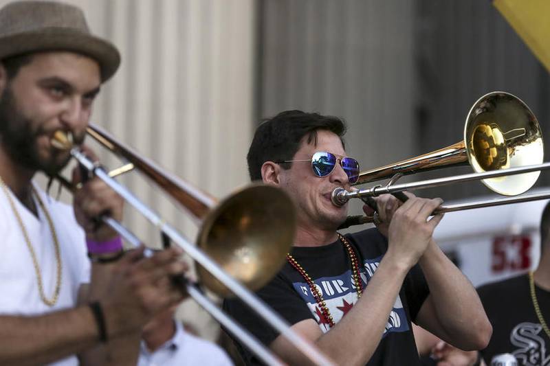 Members of the Four Star Brass Band play a set Friday during the New Orleans North celebration in downtown Joliet.