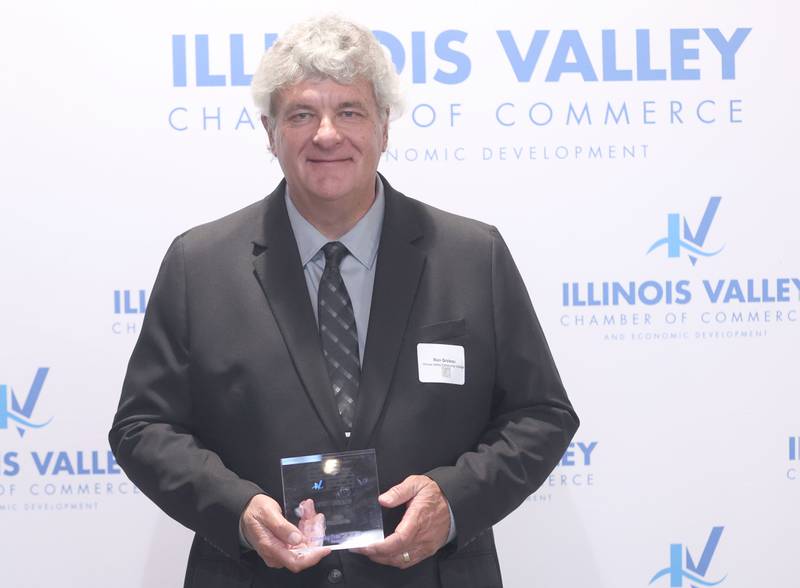 Ron Groleau poses with his Cornerstone award during the Illinois Valley Chamber of Champions of Change Awards Night on Wednesday, May 6, 2026 at the Westclox Event Center in Peru.