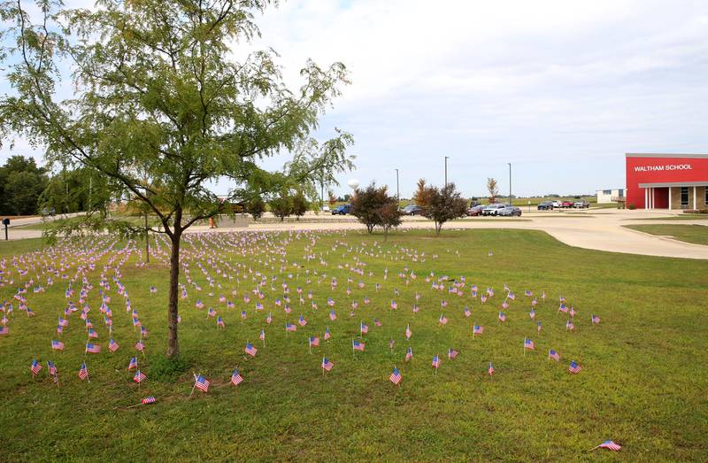 Waltham School placed 2,977 flags outside the school lawn to remember the lives lost in the 9/11 attacks on Thursday, Sept. 11, 2025 in Utica.