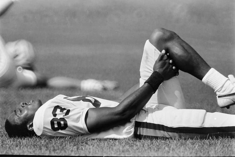 Chicago Bears wide receiver Willie Gault stretches during training camp on Wednesday, June 12, 1985 in Platteville Wis.