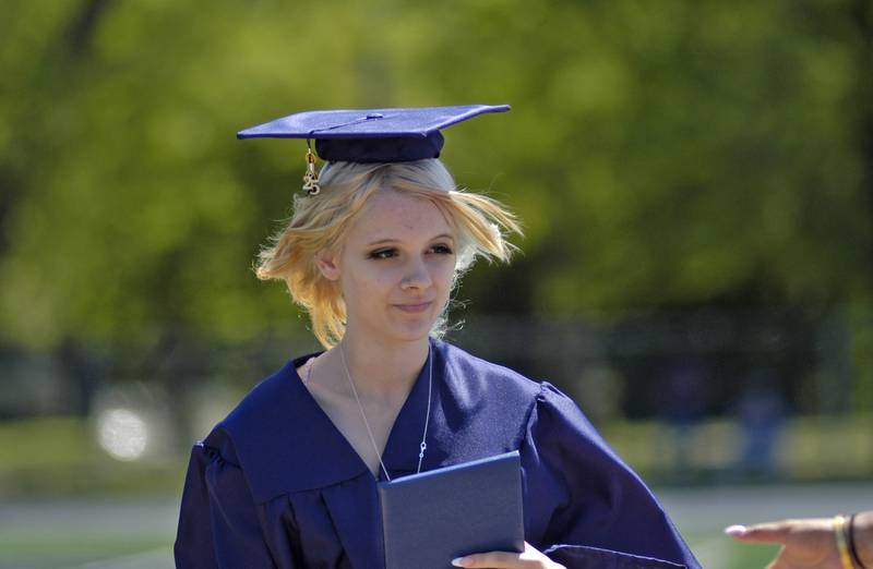 Bryanna Dawson receives her diploma.  The Sterling Class of 2025 Commencement Ceremony was held on Sunday, May 18, 2025 at Roscoe Eades Field in Sterling.