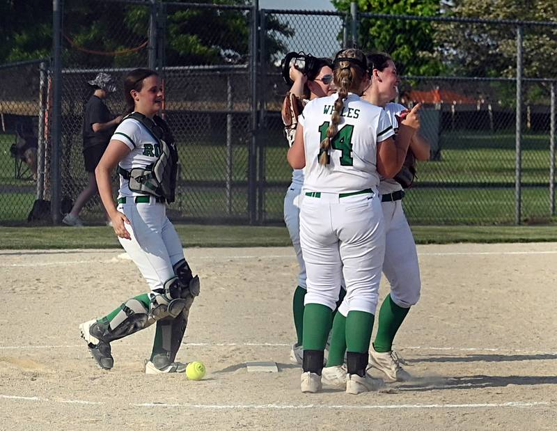 Rock Falls players gather at the pitcher's circle after defeating Richmond Burton Tuesday at the Stillman Valley sectional.