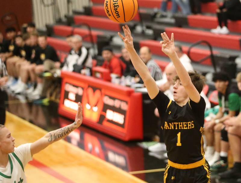 Rock Falls's Austin Castaneda eyes the hoop against Putnam County's AJ Furar during the 50th annual Colmone Classic on Monday, Dec. 9, 2024 at Hall High School.