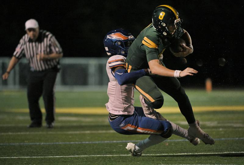 Hoffman Estates’ Dunmi Oginni sacks Fremd quarterback Johnny O'Brien in a football game in Palatine on Friday, Sept. 27, 2024.